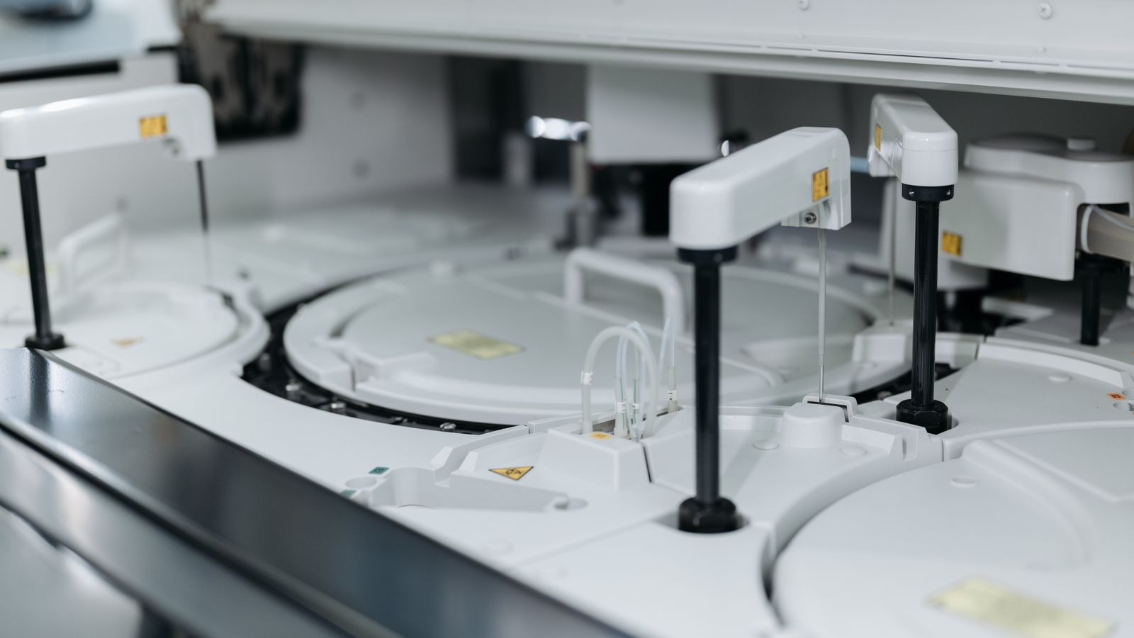 Close-up of precision laboratory instrumentation with metallic components and calibrated dials used in scientific research settings.